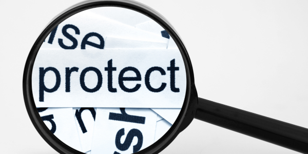 A magnifying glass hovering over the word 'PROTECT' A magnifying glass hovering over the word 'PROTECT'