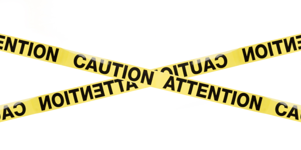 Yellow tape with the words 'CAUTION' and 'ATTENTION' in black capitals Yellow tape with the words 'CAUTION' and 'ATTENTION' in black capitals