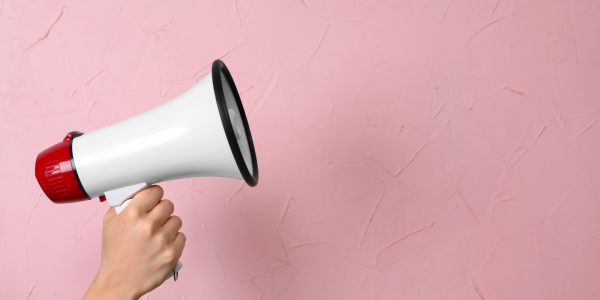 a megaphone against a pink background a megaphone against a pink background