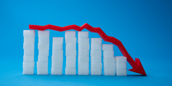 stacks of sugar cubes gradually getting smaller with a red arrow laying across the top of them pointing downwards at the end. stacks of sugar cubes gradually getting smaller with a red arrow laying across the top of them pointing downwards at the end.
