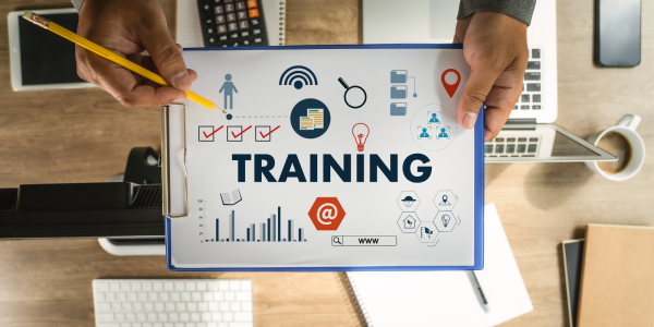a clipboard with the word 'TRAINING' and lots of graphs a clipboard with the word 'TRAINING' and lots of graphs