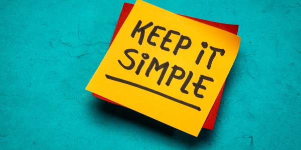a yellow post it note with the words 'KEEP IT SIMPLE!' written on it in black ink a yellow post it note with the words 'KEEP IT SIMPLE!' written on it in black ink