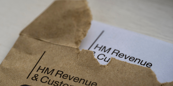 An open HMRC envelope and letter showing the HMRC logo in the top left corner. An open HMRC envelope and letter showing the HMRC logo in the top left corner.
