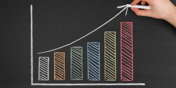 Bar chart drawn on a chalkboard with different colours, each bar gets slightly higher as the chart continues. Bar chart drawn on a chalkboard with different colours, each bar gets slightly higher as the chart continues.