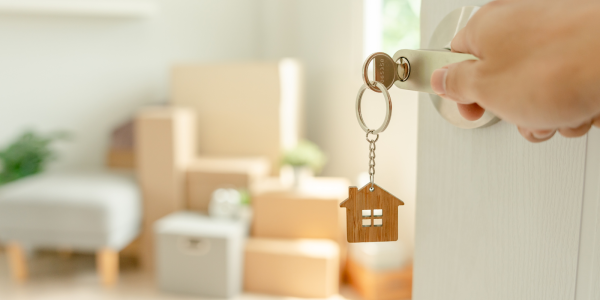 a person opening a door with a key a person opening a door with a key
