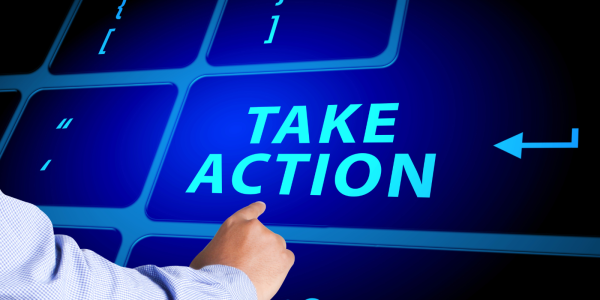 a giant virtual keyboard, a person pressing the button that says 'TAKE ACTION' a giant virtual keyboard, a person pressing the button that says 'TAKE ACTION'