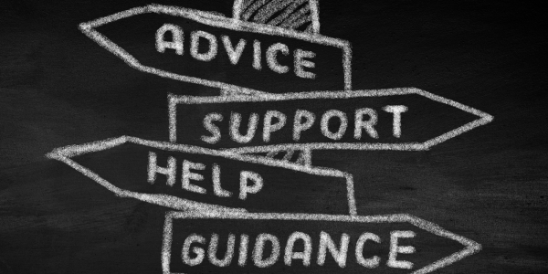 A chalkboard with a drawing of a street sign there are 4 signs that read 'ADVICE', 'SUPPORT', 'HELP', 'GUIDANCE' A chalkboard with a drawing of a street sign there are 4 signs that read 'ADVICE', 'SUPPORT', 'HELP', 'GUIDANCE'