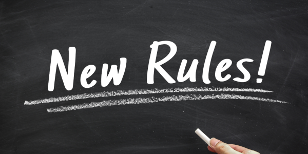 words written on a chalkboard in white chalk, the words read 'NEW RULES!' words written on a chalkboard in white chalk, the words read 'NEW RULES!'