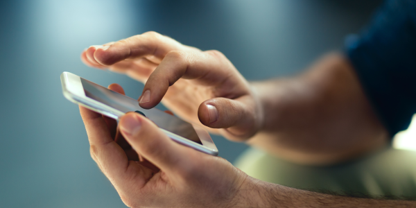 a person holding a smartphone a person holding a smartphone