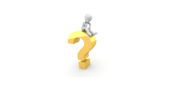 A person sat thinking on top of a large golden coloured question mark. A person sat thinking on top of a large golden coloured question mark.
