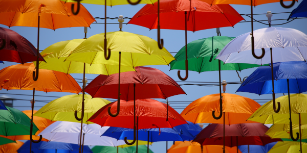 Lots of colourful umbrella's hanging from cords in the sky Lots of colourful umbrella's hanging from cords in the sky