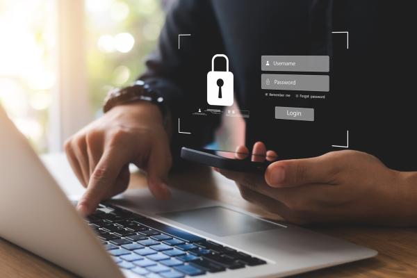 hand_and_smartphone_laptop_graphic_of_padlock hand_and_smartphone_laptop_graphic_of_padlock.jpg