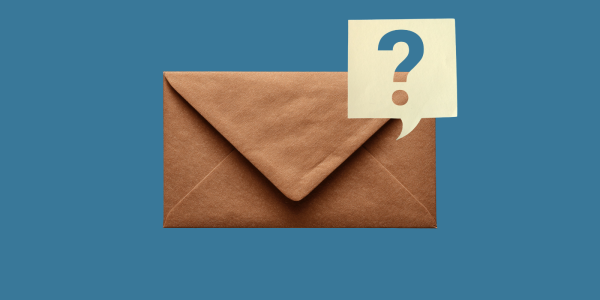 A brown HMRC envelope with a speech bubble coming from it showing a question mark