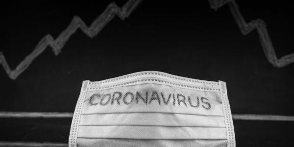 Coronavirus mask and graph behind