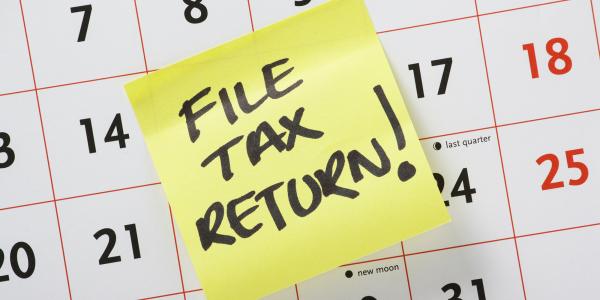 Image of a sticky note saying file tax return