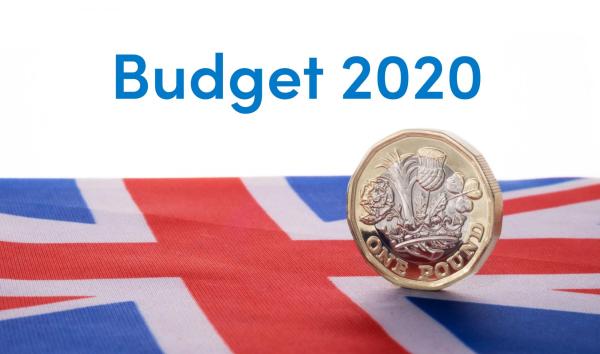 Pound coin on Union Jack flag representing the 2020 Budget